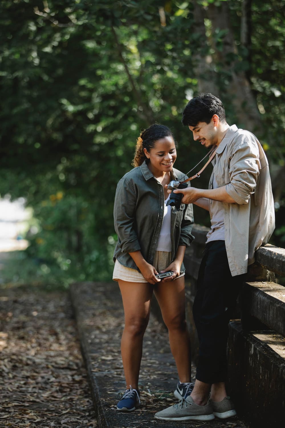 woman looking at camera a man is holding