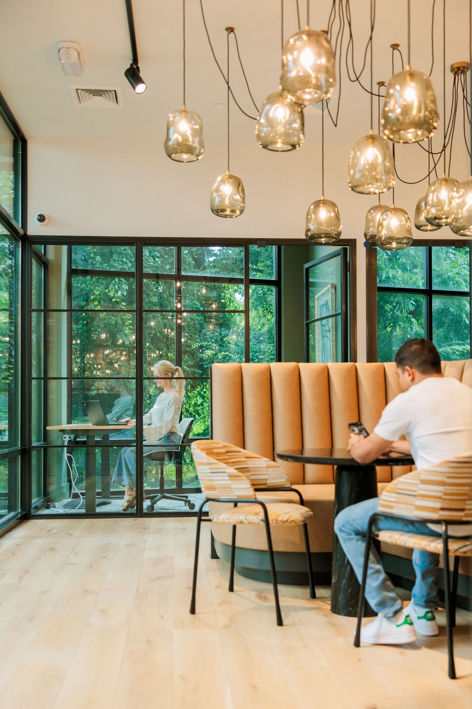man and woman in co working space with private rooms