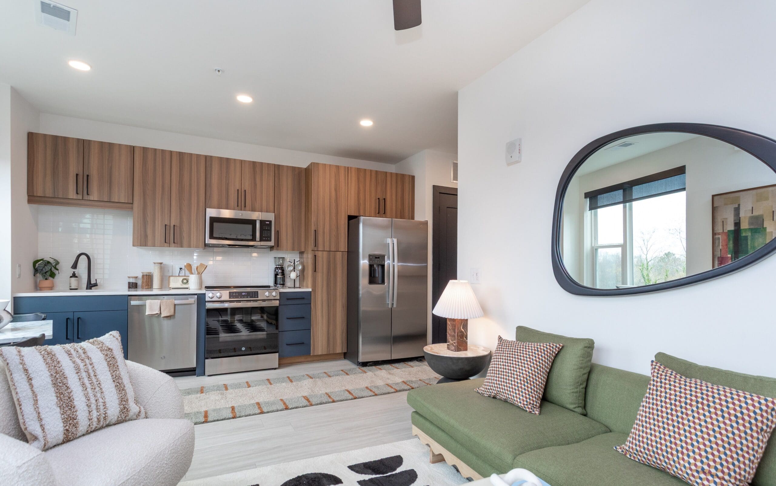 The Row furnished model. Kitchen with updated appliances and decorated living room.