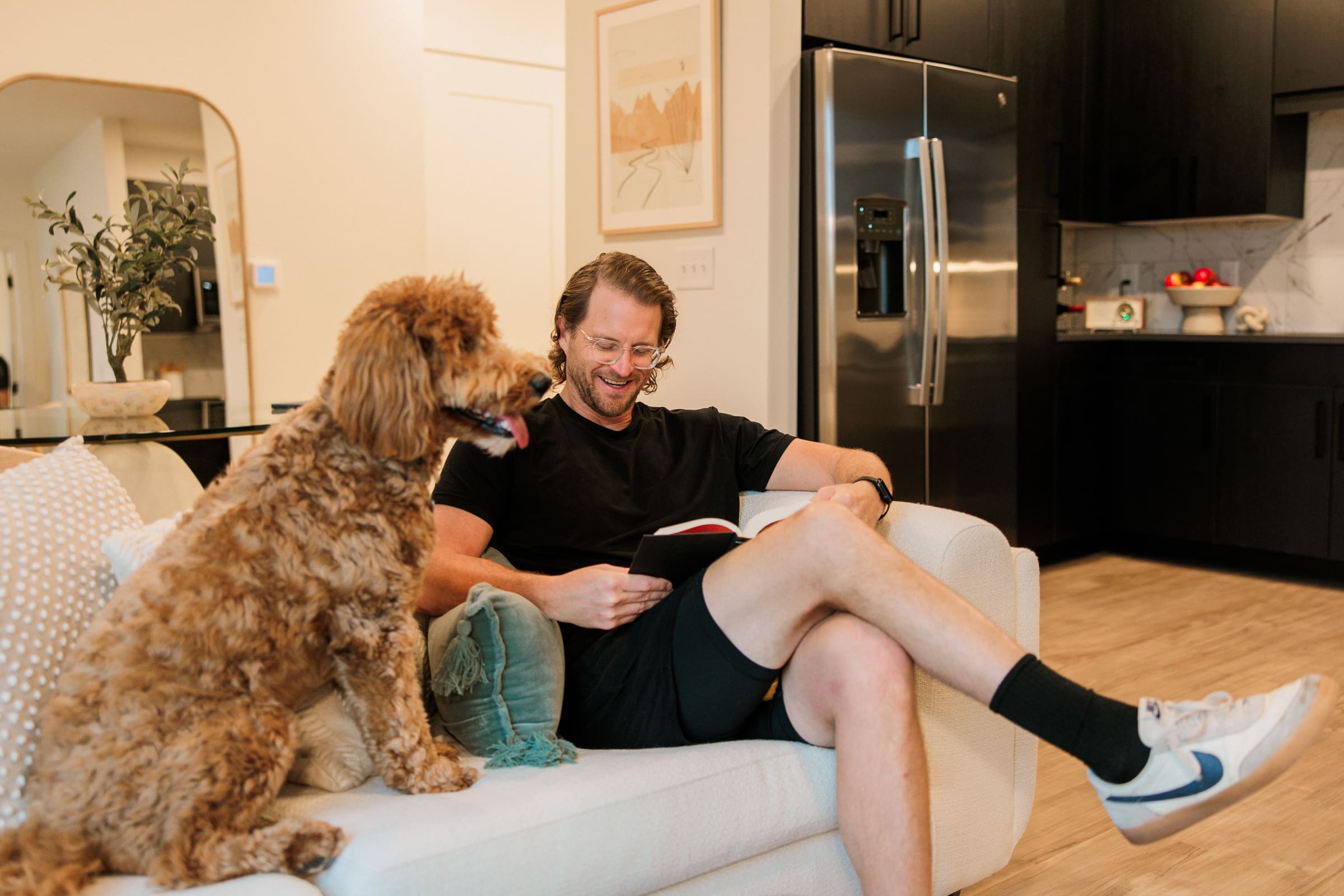 Man and dog in model apartment